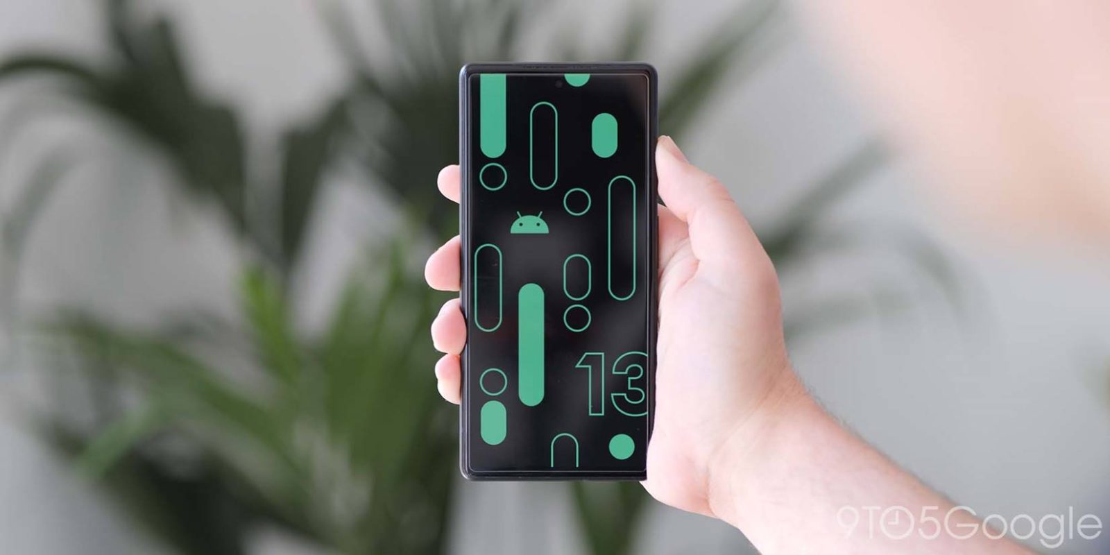 Android 13 logos on a Pixel phone