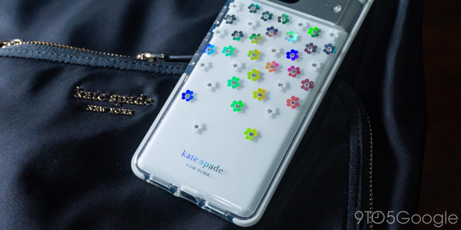 Pixel 7 in a Kate Spade case, resting on a Kate Spade backpack
