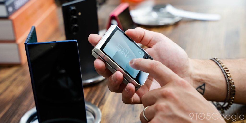 The Galaxy Z Flip 7 FE held in a hand as someone interacts with the cover display.